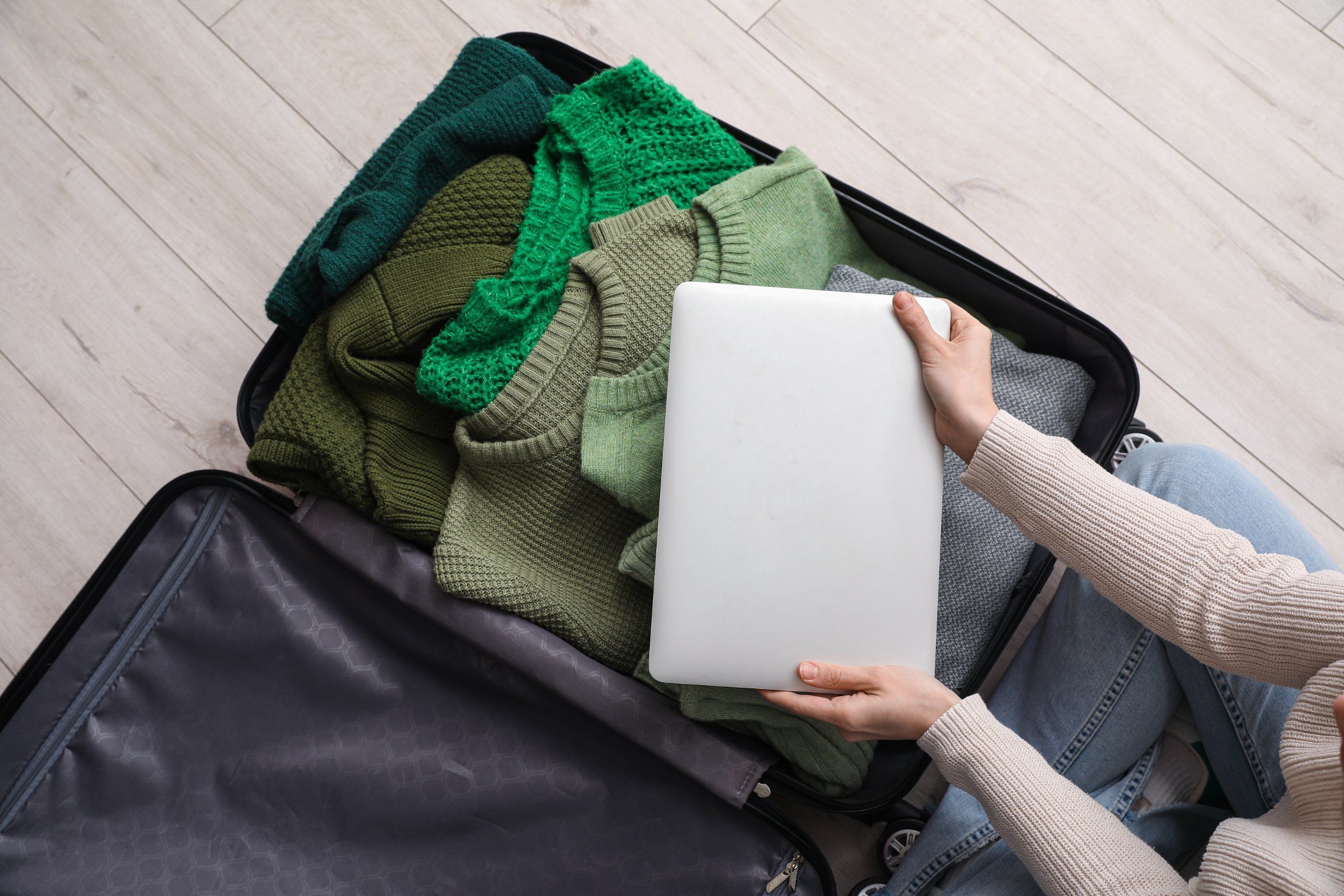 04-packing-sweaters-laptop.jpg